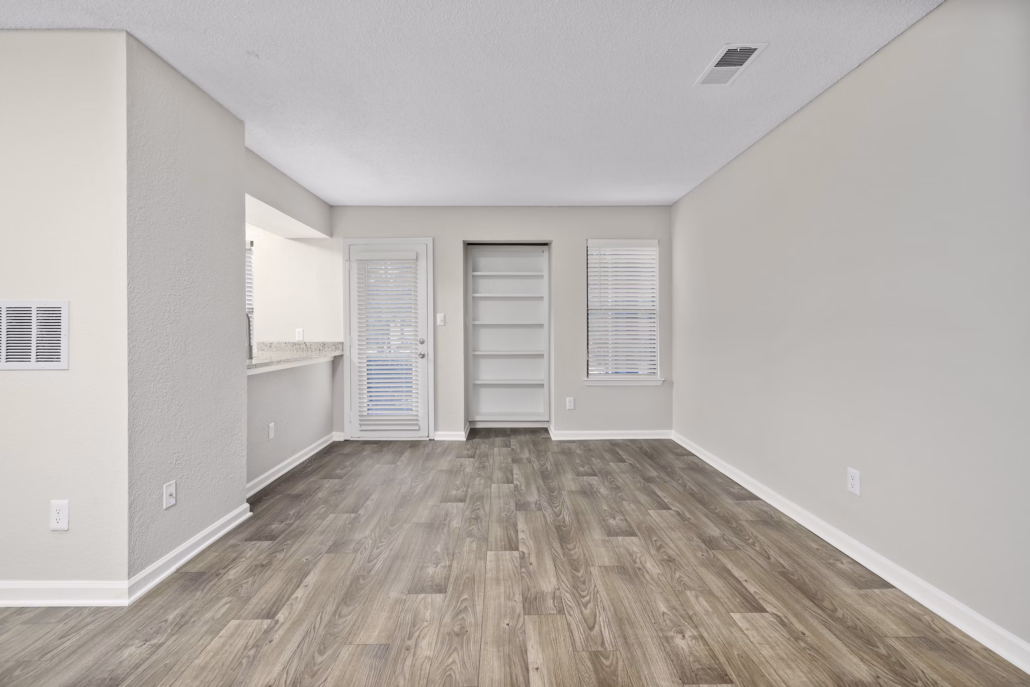 Spacious living room with modern decor at Sailboat Bay Apartments
