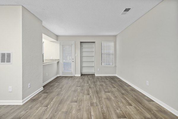 Spacious living room with modern decor at Sailboat Bay Apartments