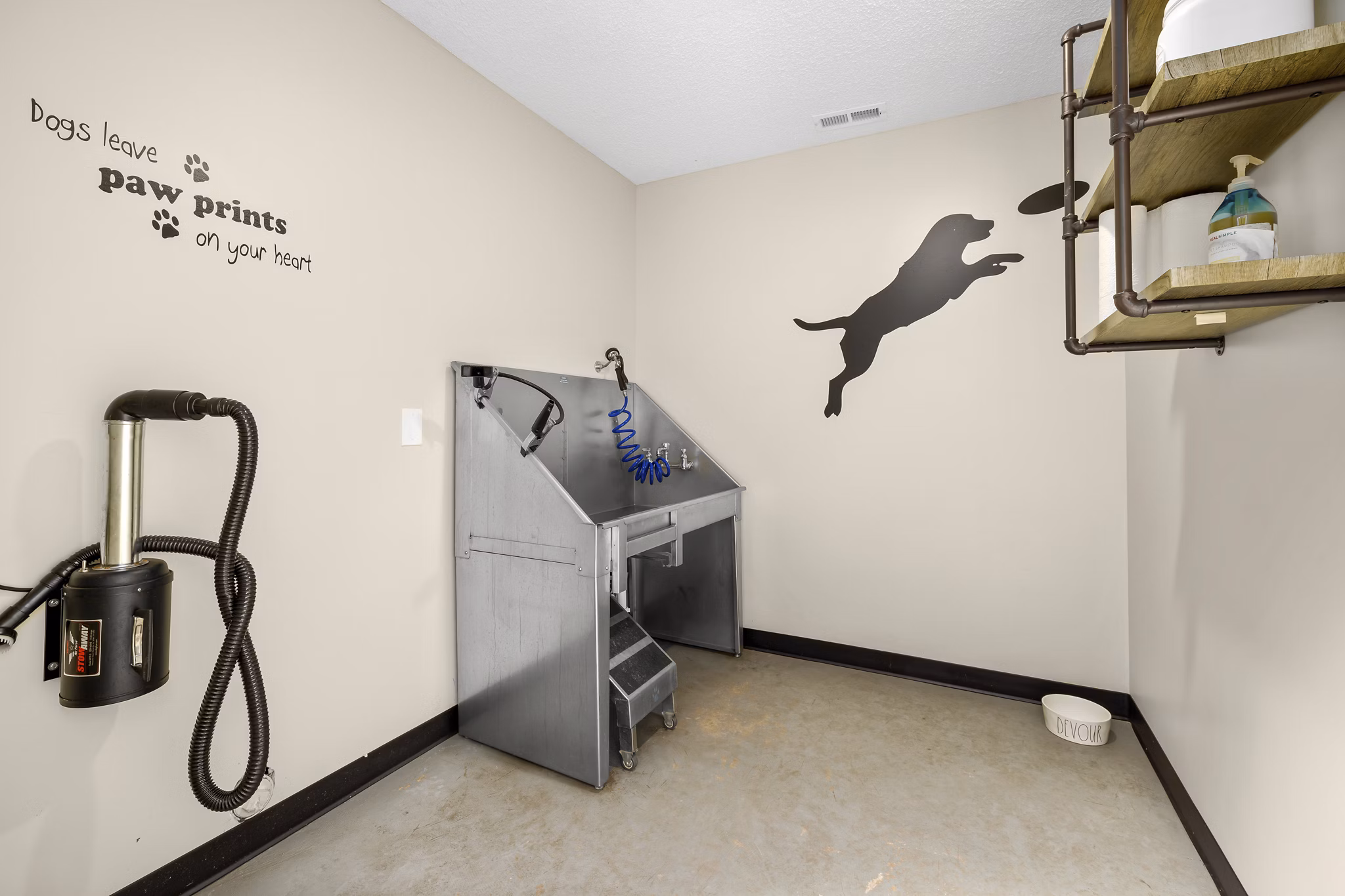 Dog wash station at Sailboat Bay Apartments with modern amenities for pet-friendly living