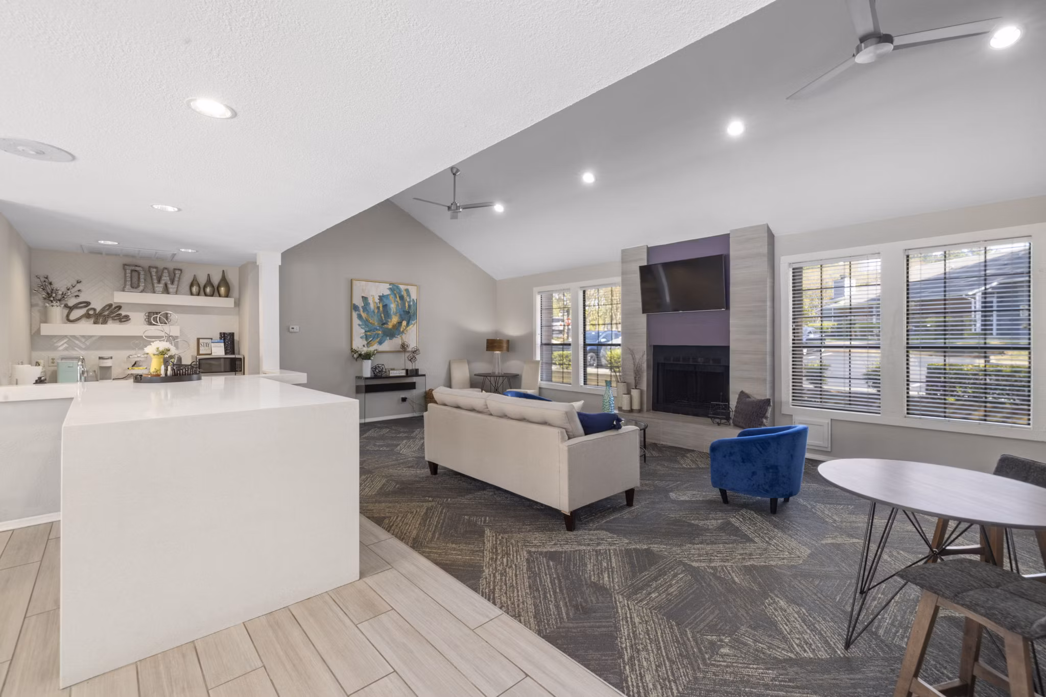 Modern clubhouse with cozy seating and billiards table at Duraleigh Woods Apartments