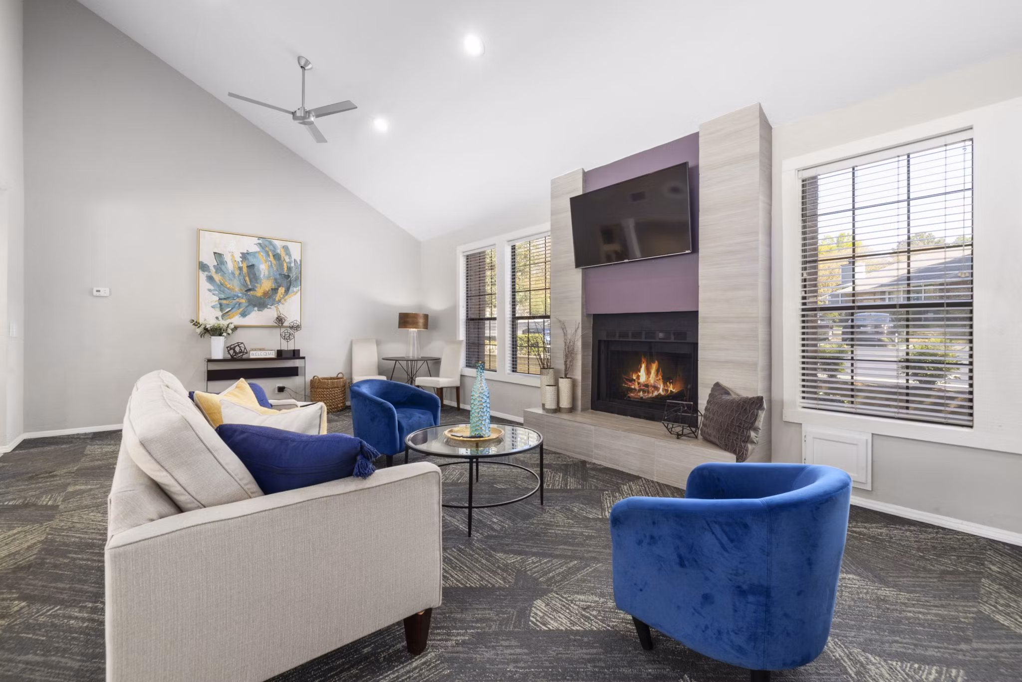 Clubhouse featuring modern interiors at Duraleigh Woods Apartments with spacious seating and entertainment areas