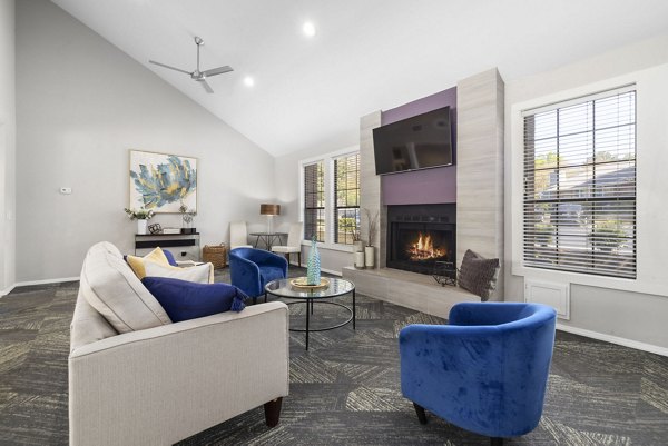 Clubhouse featuring modern interiors at Duraleigh Woods Apartments with spacious seating and entertainment areas