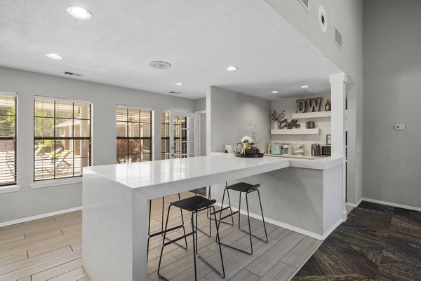 Clubhouse with modern design and comfy seating at Duraleigh Woods Apartments