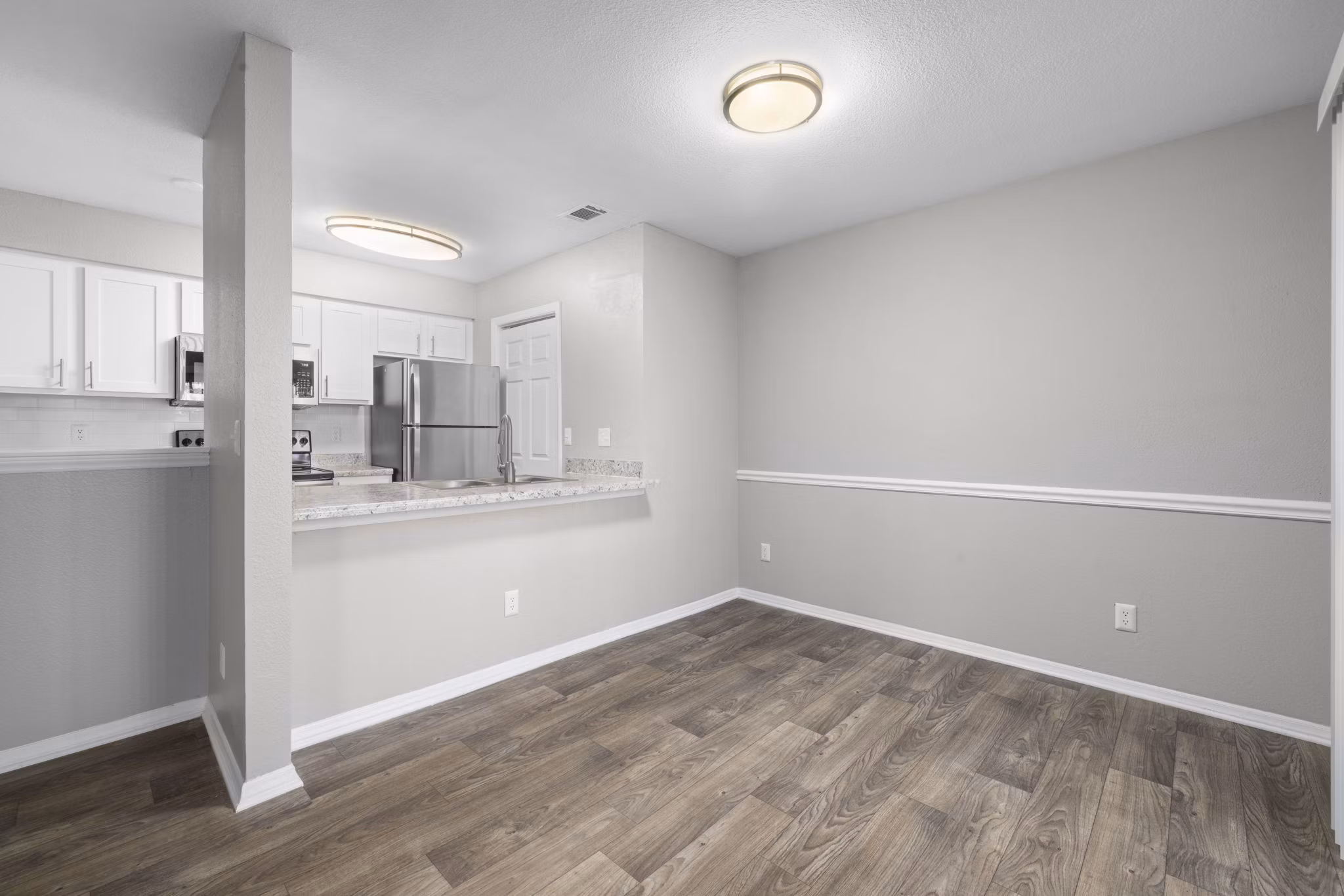 Elegant dining area with modern furnishings at Duraleigh Woods Apartments, offering luxury living spaces in a serene setting