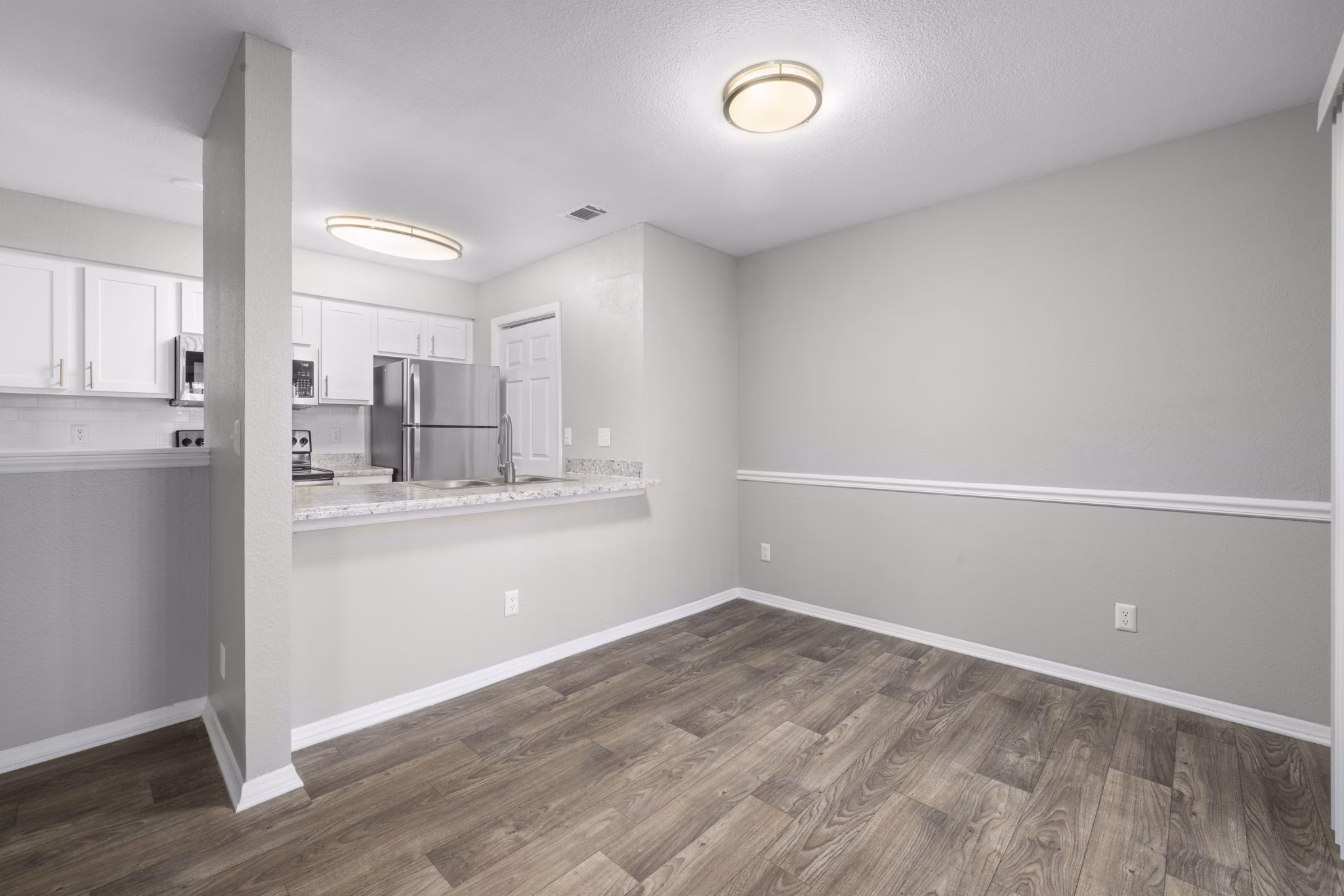 Elegant dining area with modern furnishings at Duraleigh Woods Apartments, offering luxury living spaces in a serene setting