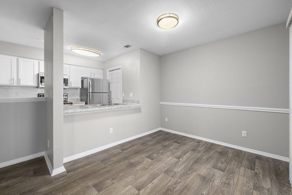 Elegant dining area with modern furnishings at Duraleigh Woods Apartments, offering luxury living spaces in a serene setting