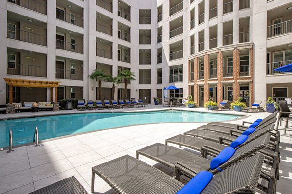Poolside relaxation area at Mosaic South End: luxury apartments in vibrant urban setting