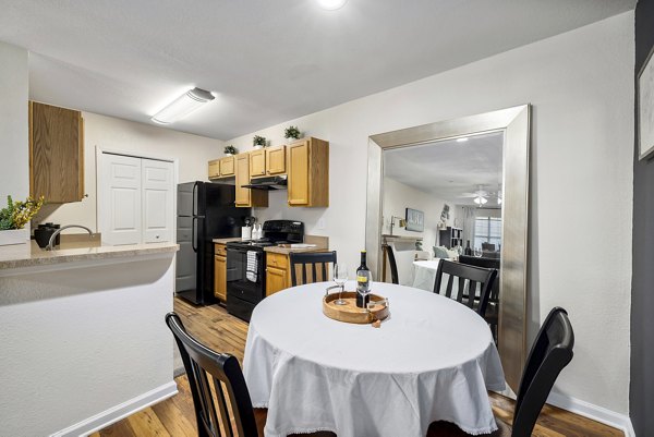 Contemporary dining area with elegant decor in Encore at the Park Apartments