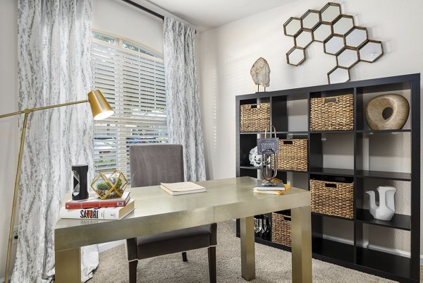 Modern kitchen featuring stainless steel appliances at Encore at the Park Apartments