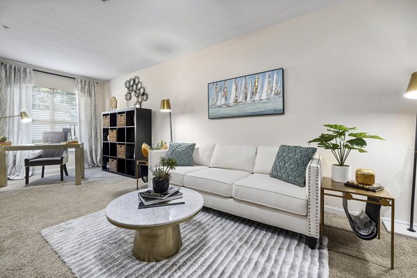 Modern living room with elegant furnishings at Encore at the Park Apartments