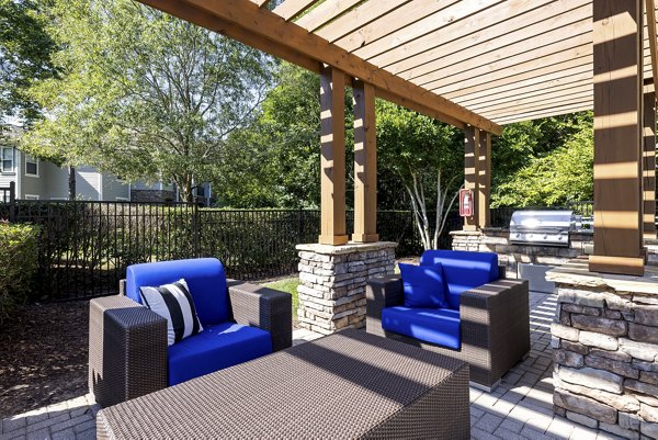 Outdoor grill area at Encore at the Park: Luxury apartments with landscaped gardens