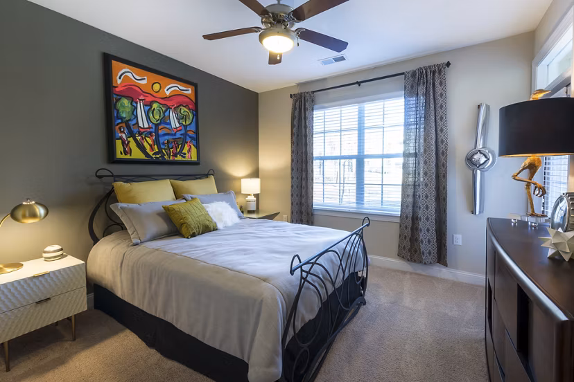 Bedroom featuring modern furnishings and natural light in Morgan Reserve Apartments