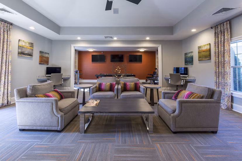 Clubhouse with modern seating and decor at Morgan Reserve Apartments, luxury living community by Greystar