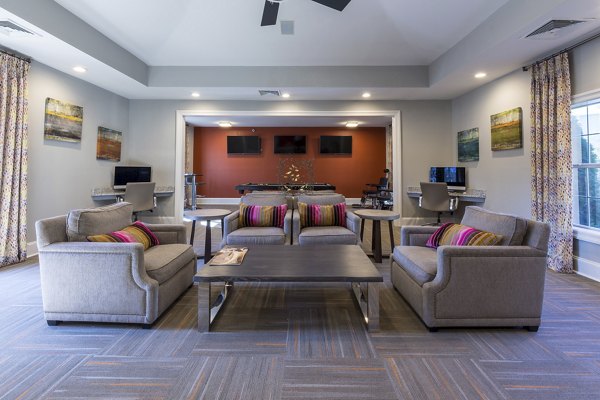 Clubhouse with modern seating and decor at Morgan Reserve Apartments, luxury living community by Greystar