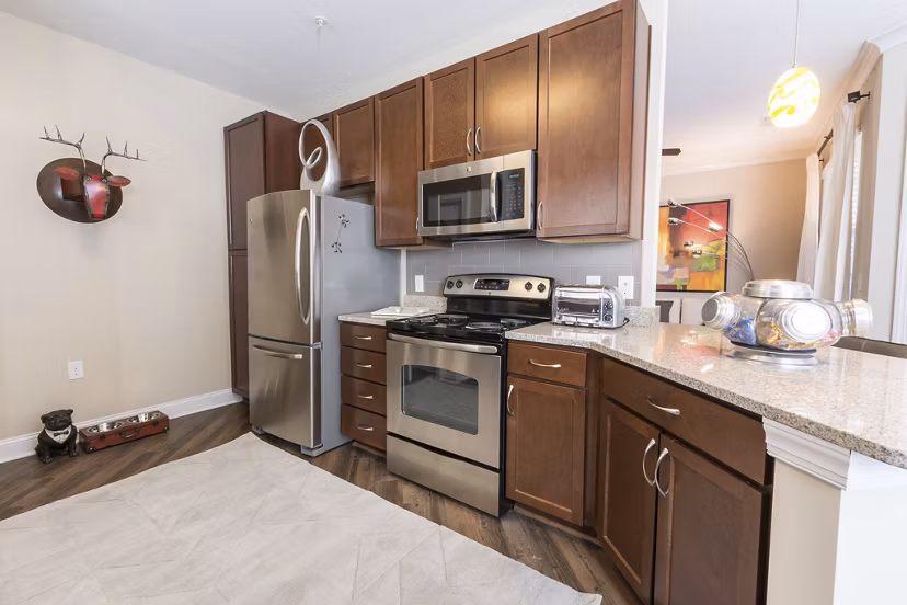 Modern kitchen with stainless steel appliances at Morgan Reserve Apartments