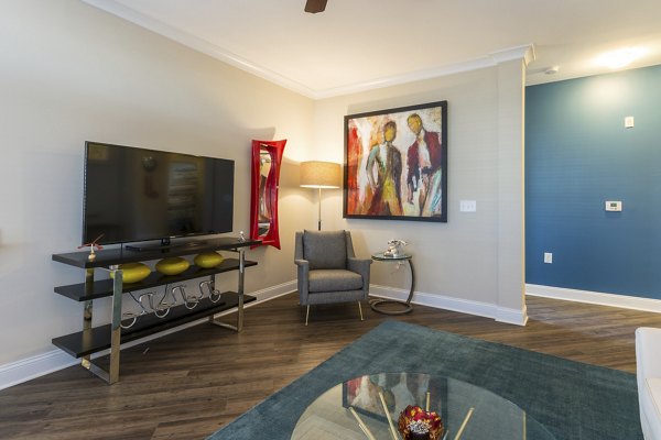 Living room with stylish decor and natural light at Morgan Reserve Apartments
