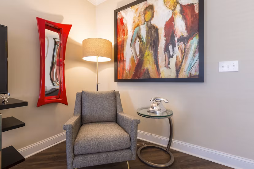 Bright living room with modern decor and large windows at Morgan Reserve Apartments, luxury apartment living