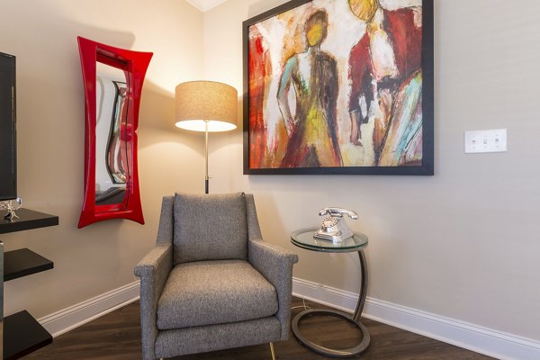 Bright living room with modern decor and large windows at Morgan Reserve Apartments, luxury apartment living