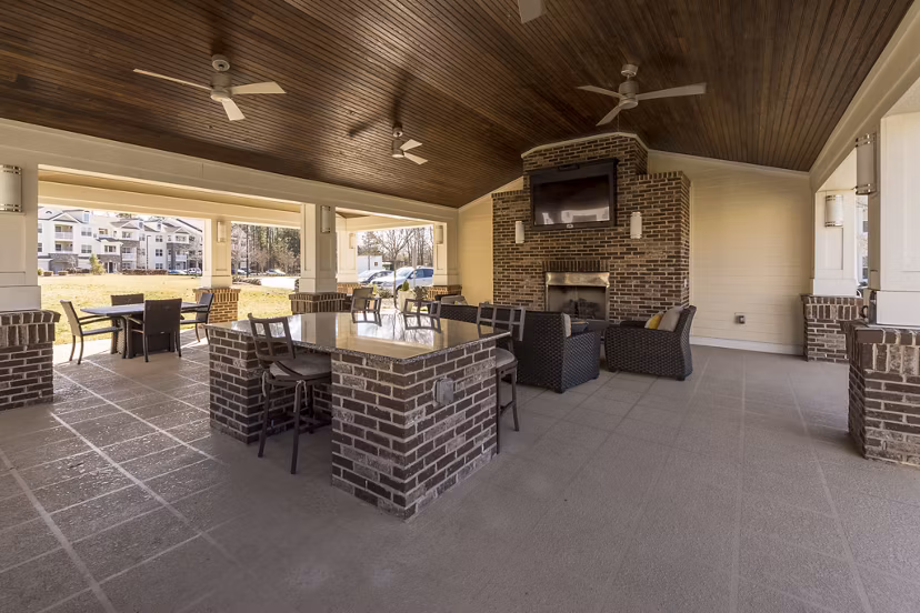 Morgan Reserve Apartments: Stylish patio with modern seating and lush greenery perfect for relaxation