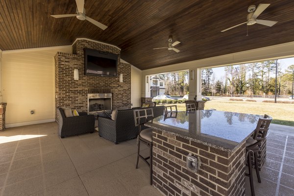 Patio with modern outdoor seating at Morgan Reserve Apartments, ideal for relaxation in premium living spaces