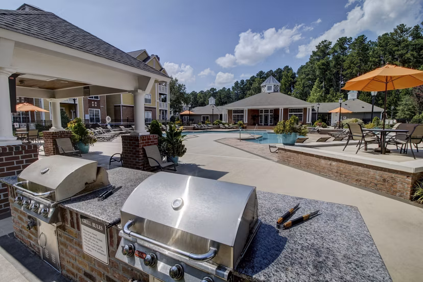 Outdoor grill area for social gatherings at Morgan Reserve Apartments, luxury community living by Greystar