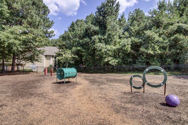 Spacious dog park with agility equipment at Morgan Reserve Apartments, perfect for pet-friendly living