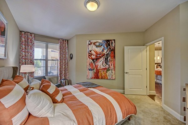 Modern bedroom with sleek design features at Yards at Noda Apartments