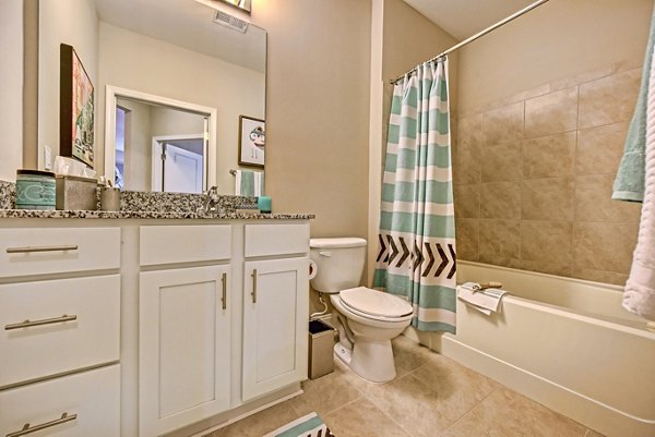 Modern bathroom with sleek fixtures at Yards at Noda Apartments