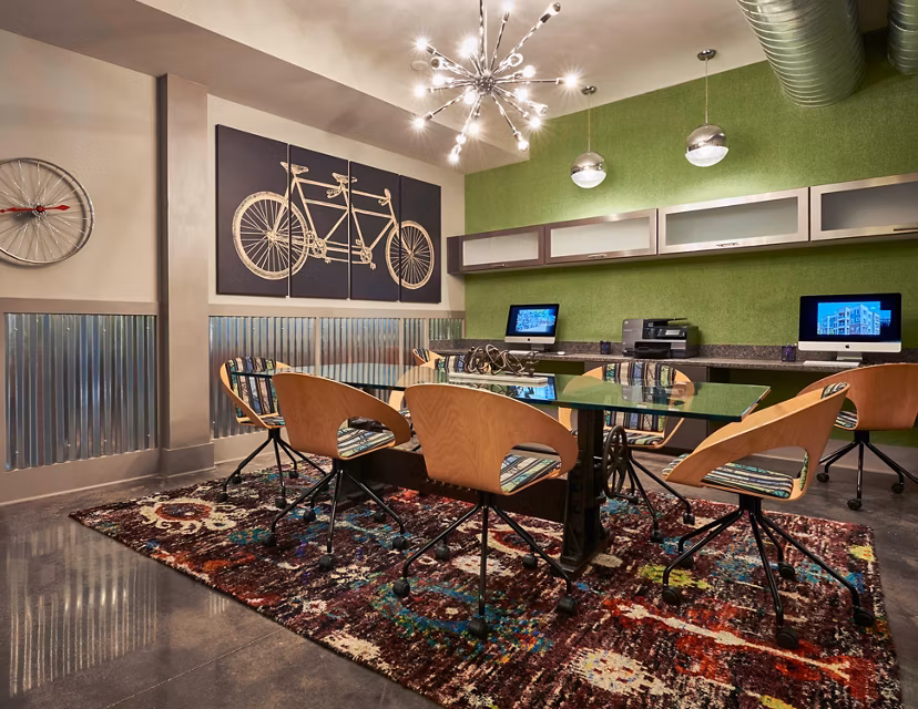 Clubhouse at Yards at Noda Apartments: Modern social space with cozy seating and contemporary design elements in Charlotte, North Carolina