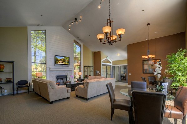 Clubhouse featuring modern design and communal seating at Canyon Woods Apartments