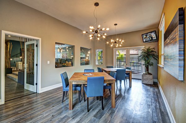 Clubhouse featuring modern design and communal seating at Hampton Greens Apartments