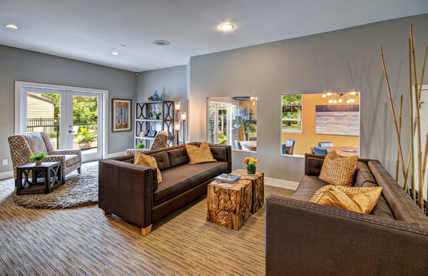 Chic clubhouse with cozy seating and modern decor at Hampton Greens Apartments