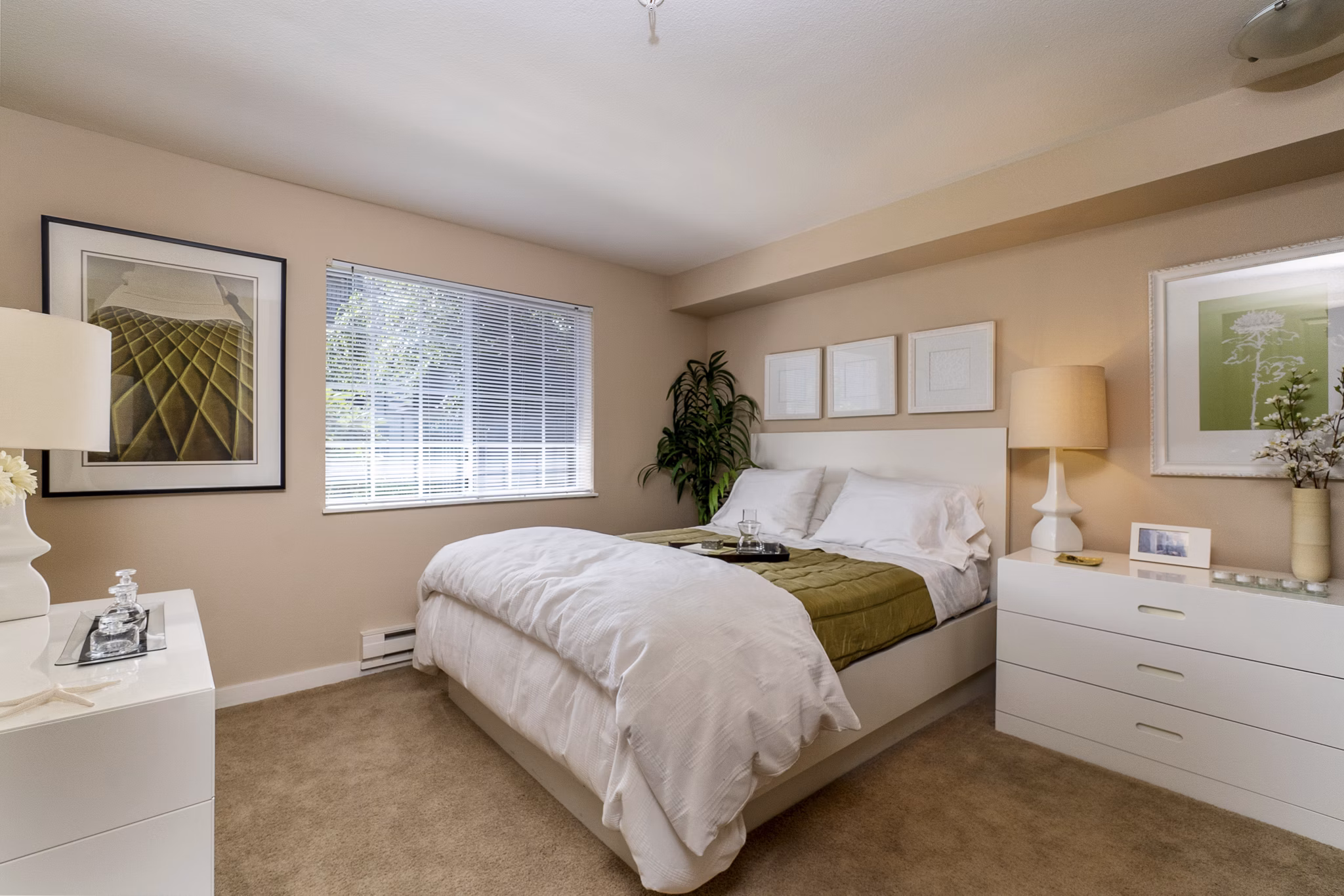 Spacious bedroom with modern design elements in BluWater Apartments, featuring luxury amenities and serene views