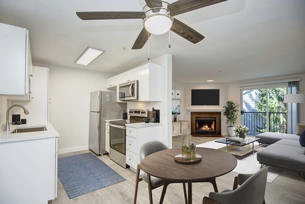 Modern kitchen featuring stainless steel appliances at BluWater Apartments