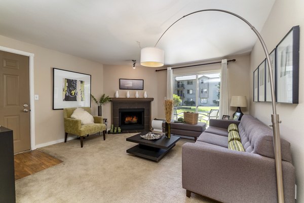 Spacious living room with modern decor at BluWater Apartments