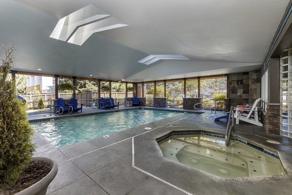 Resort-style pool at BluWater Apartments with luxury sun decks and cabanas, offering a relaxing getaway in a premier living community