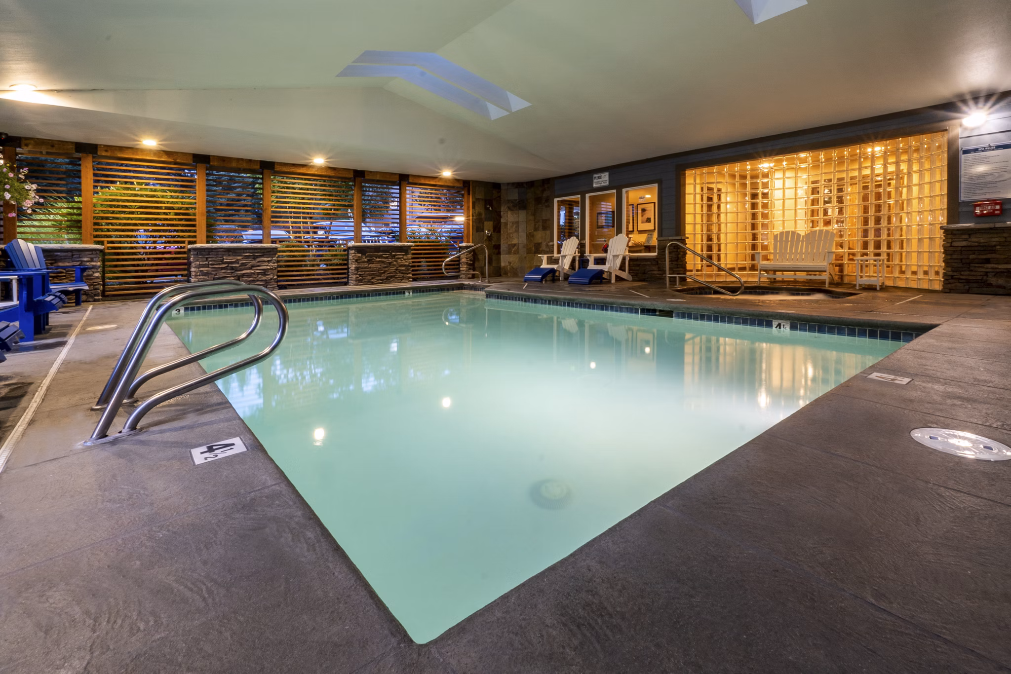 Expansive outdoor pool at BluWater Apartments offering relaxation and luxury living