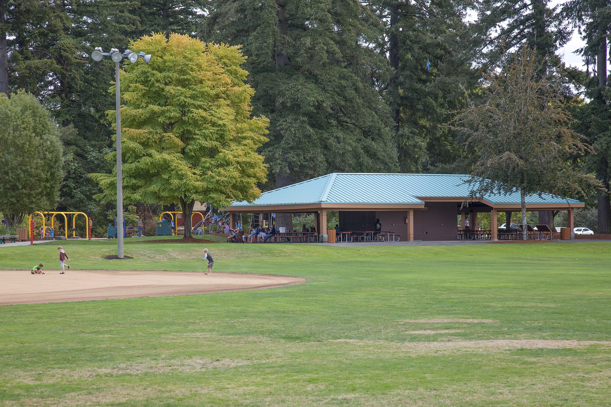 Recreational area with green spaces and seating at Arya at Hedges Creek Apartments