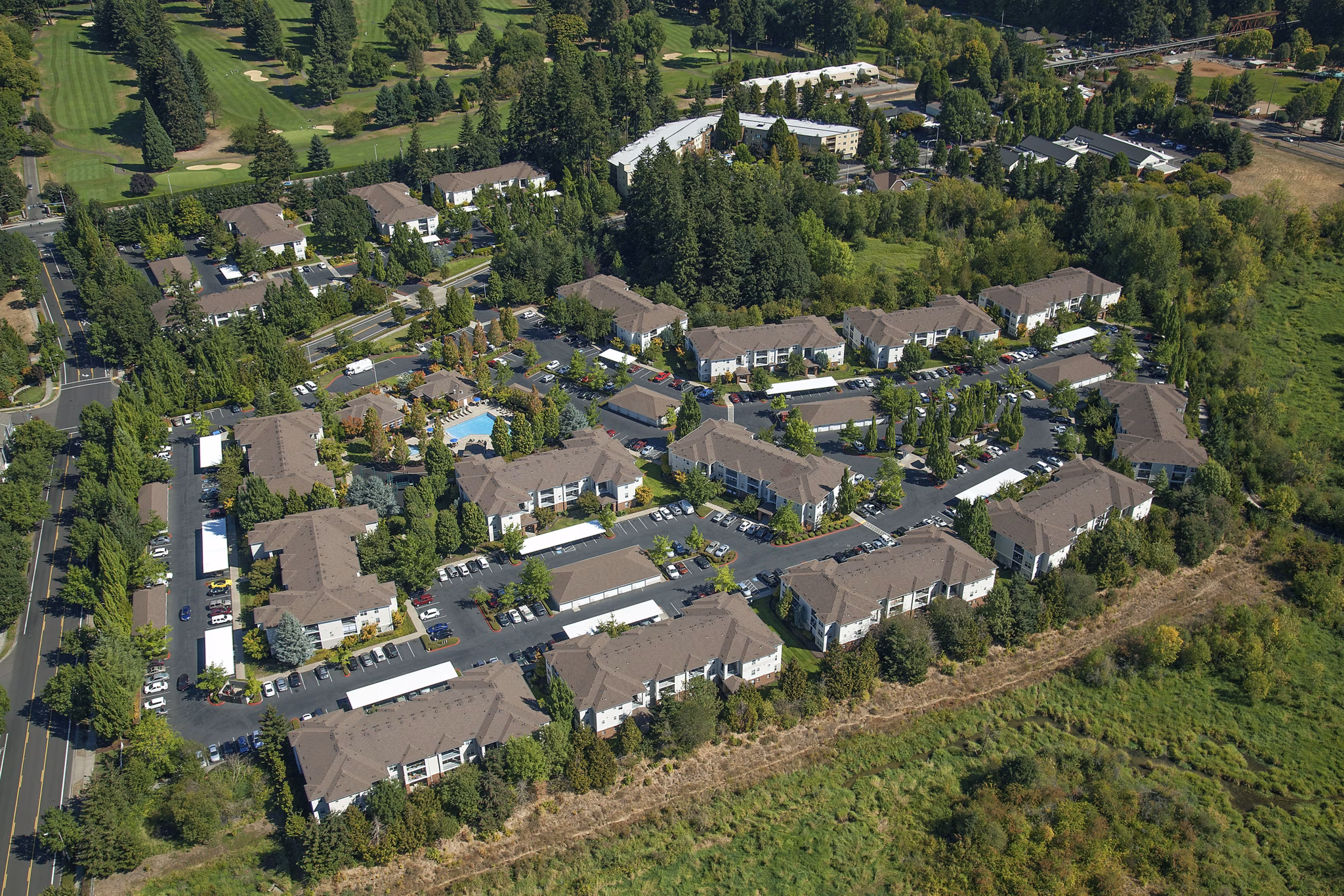 Arya at Hedges Creek: Scenic view of luxury apartments with lush landscaping and modern architecture