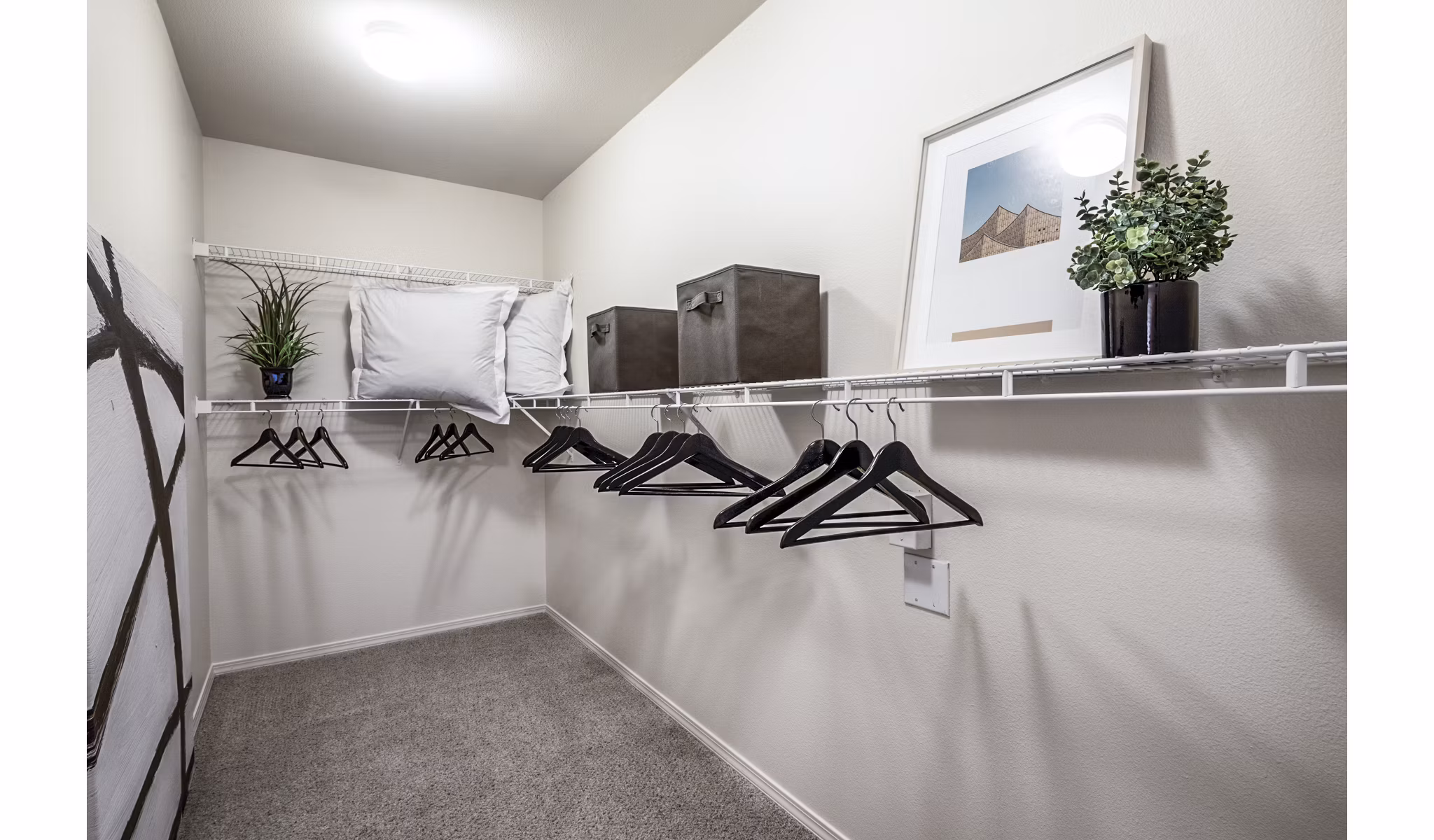 Bedroom closet with modern shelving and ample storage in Allure Apartments luxury property