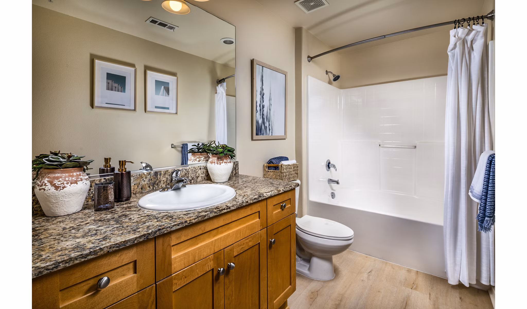 Modern bathroom with sleek fixtures at Allure Apartments, showcasing luxury living in a contemporary design