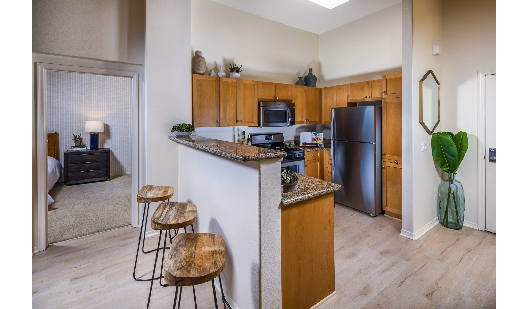 Dining room with modern furnishings and elegant lighting at Allure Apartments