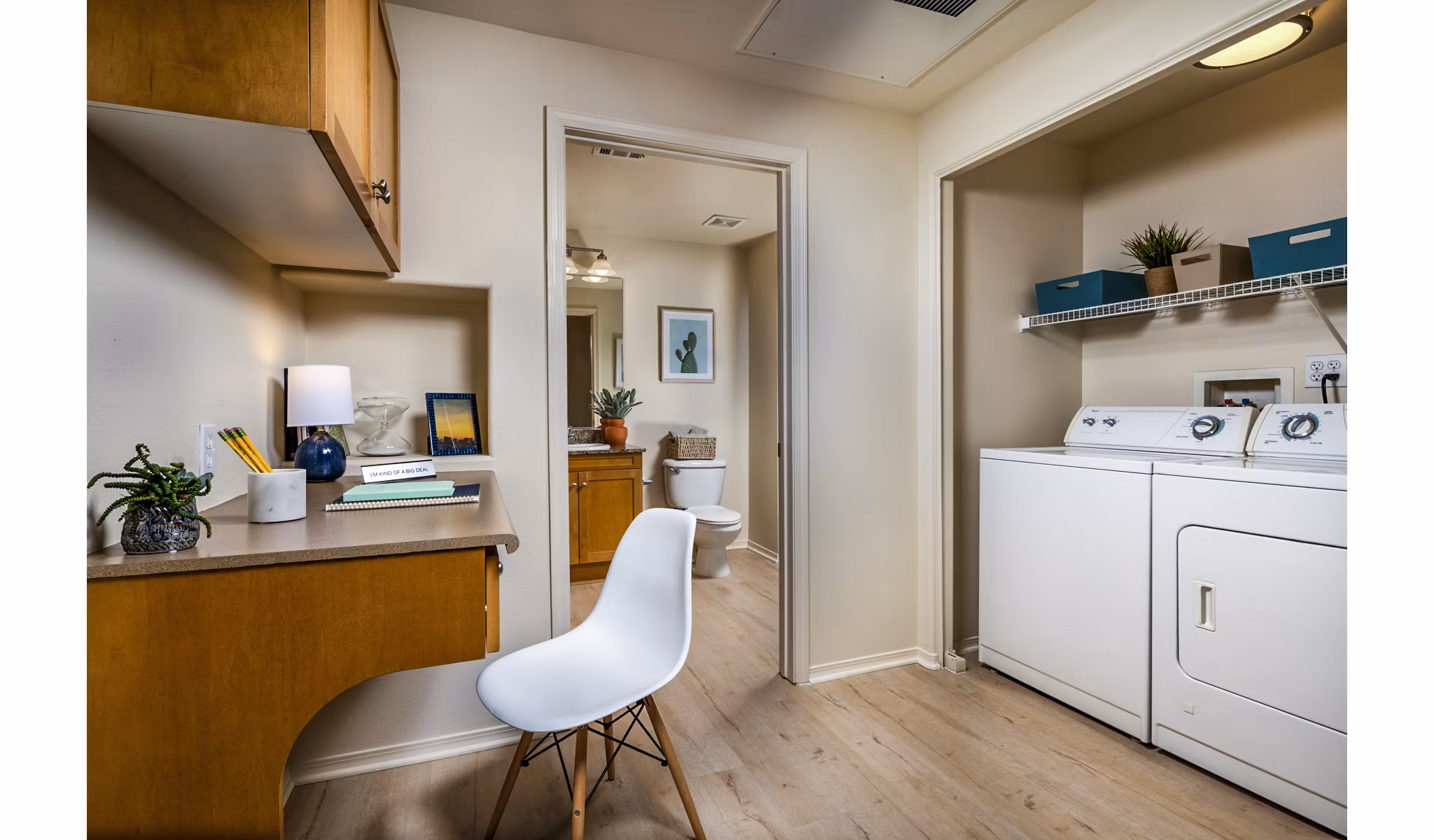 Laundry room featuring modern appliances in Allure Apartments