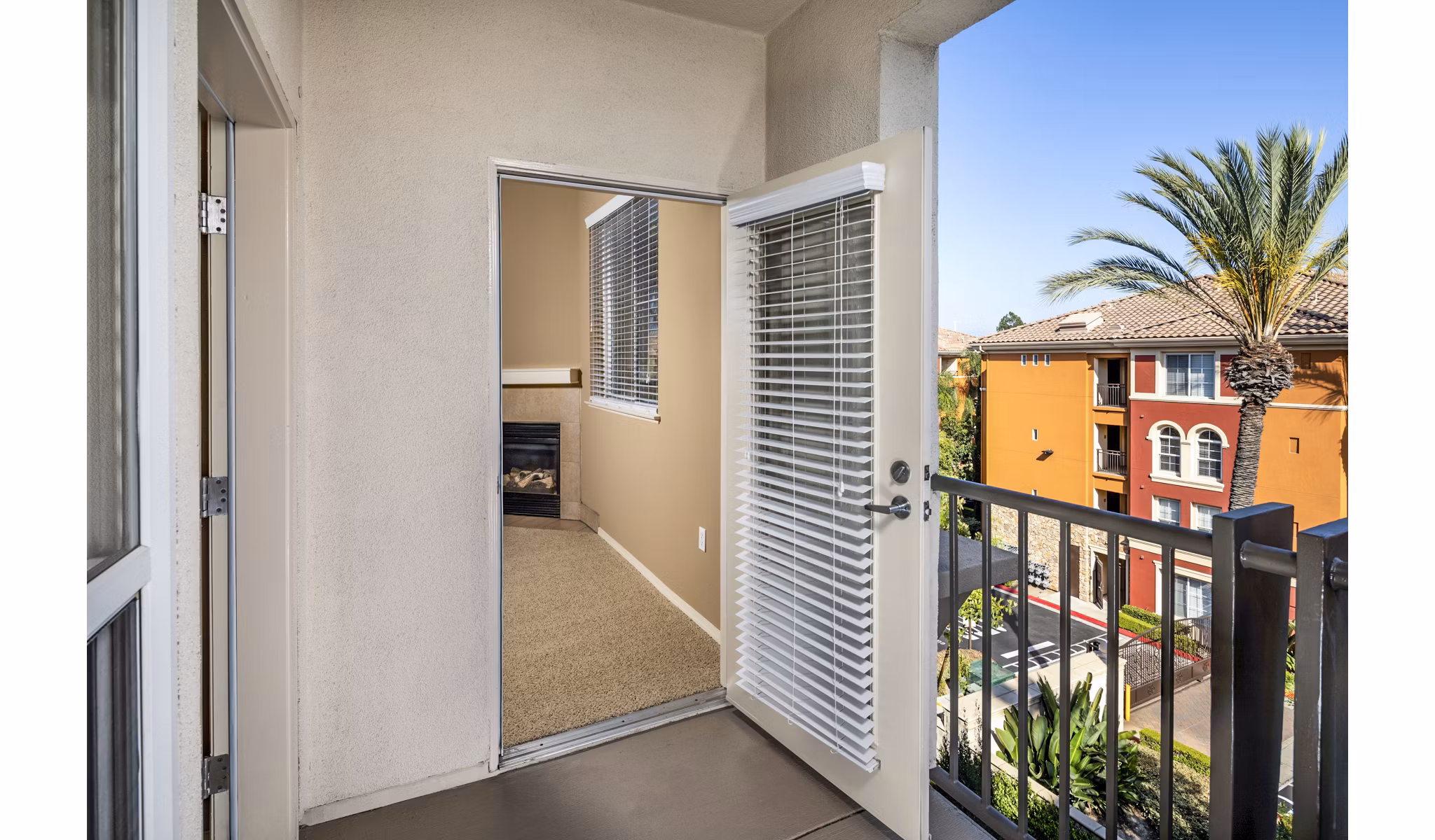 Cozy balcony patio with city views in Allure Apartments
