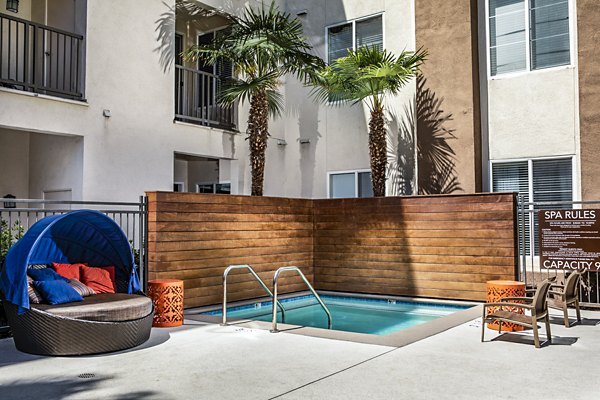 Relaxing hot tub and jacuzzi at Allure Apartments offering resort-style amenities in a serene setting