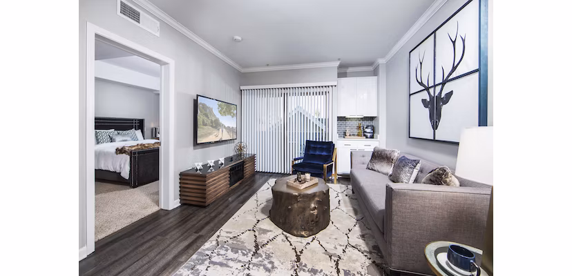 Modern living room with sleek furnishings at Avana on Wilshire Apartments, highlighting luxury urban lifestyle in Los Angeles