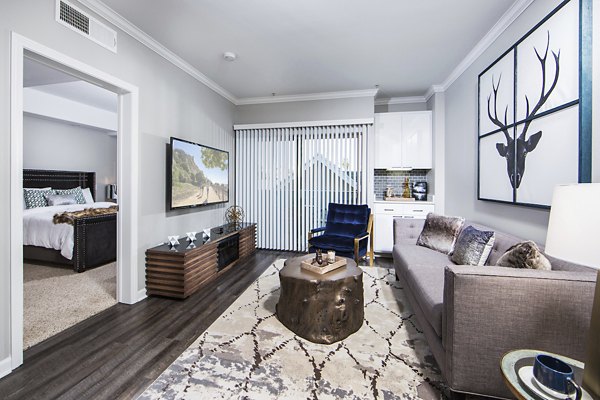 Modern living room with sleek furnishings at Avana on Wilshire Apartments, highlighting luxury urban lifestyle in Los Angeles
