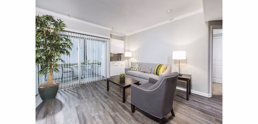 Spacious living room with modern decor at Avana on Wilshire Apartments in Los Angeles
