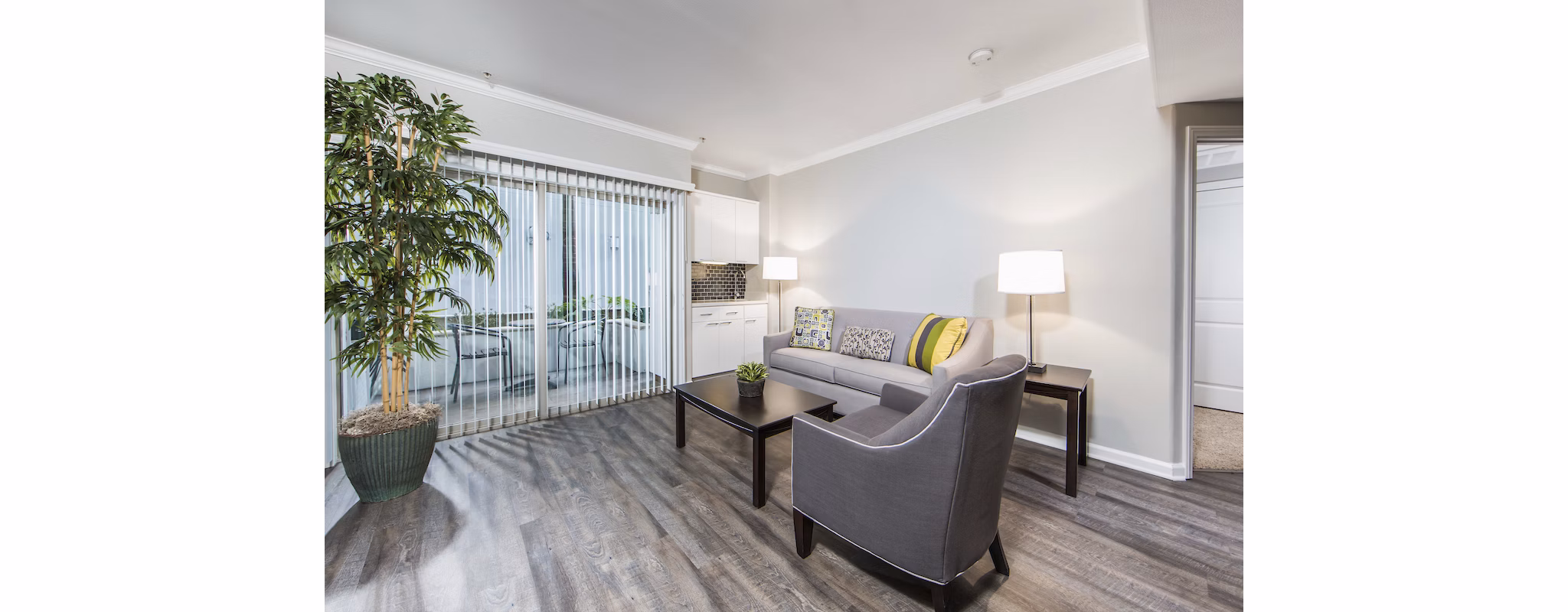 Spacious living room with modern decor at Avana on Wilshire Apartments in Los Angeles