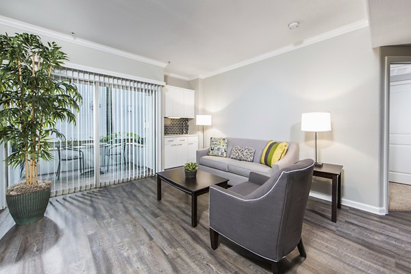 Spacious living room with modern decor at Avana on Wilshire Apartments in Los Angeles